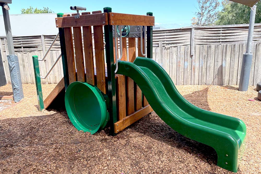 Sparrow Early Learning Bunyip playground with timber play structure, climbing wall, tunnel and slide